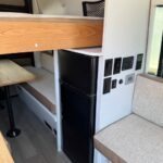 bed and fridge in mercedes benz sprinter interior